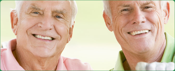 Two older men smiling