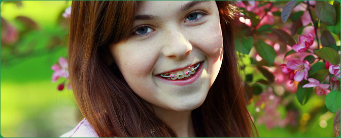 Girl with braces smiling outside